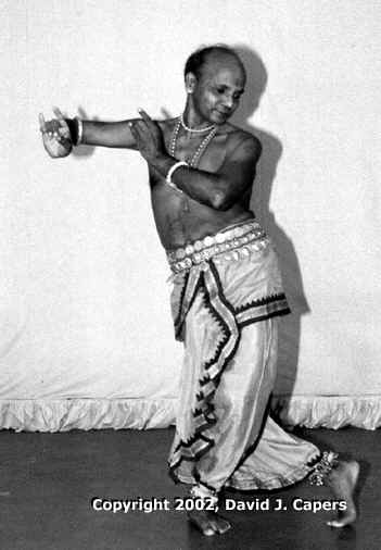 Guru Kelucharan Mohapatra demonstrates an Orissi Dance pose for Krishna